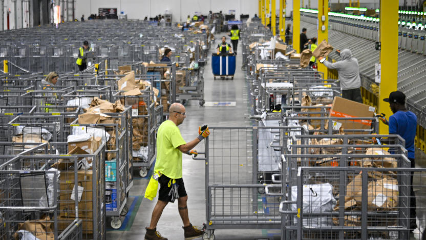 ORLANDO, FLORIDA  DECEMBER 2: Amazon employees work to fulfill same-day orders during Cyber Monday, one of the company busiest days of the year. The fulfillment center, one of Amazon largest for same-day deliveries, saw more than 200 workers sorting, packing and shipping items throughout Central Florida. On any given day, this location processes more than 20,000 packages, but during the holiday season, that number jumps to more than 80,000. (Photo by Miguel J. Rodriguez Carrillo/Getty Images)