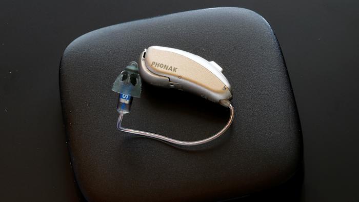 A Phonak Audeo B-Direct hearing aid of Swiss manufacturer Sonova lies on a Phonak TV Connector device in Staefa, Switzerland August 16, 2017. REUTERS/Arnd Wiegmann