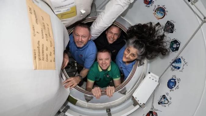 Four people at ISS.