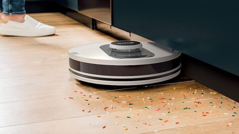 A robot vacuum cleaning up sprinkles.