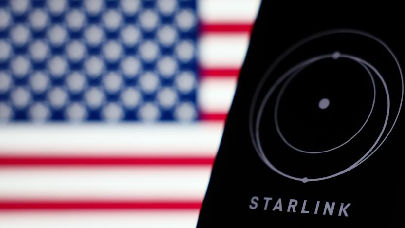 American flag displayed on a laptop screen and Starlink logo displayed on a phone screen are seen in this illustration photo taken in Krakow, Poland on March 11, 2025. (Photo by Jakub Porzycki/NurPhoto via Getty Images)