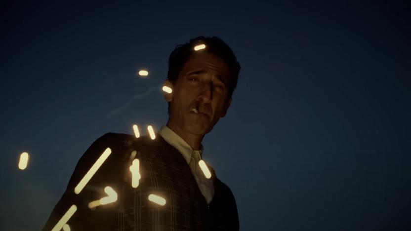 Adrien Brody in The Brutalist, staring at a firework while smoking a cigarette.