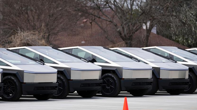 Tesla Cybertrucks are seen parked at a dealership Wednesday, March 12, 2025, in Plano, Texas. (AP Photo/Julio Cortez)